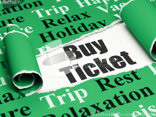 Image of Travel concept: black text Buy Ticket under the piece of  torn paper