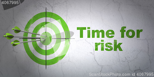 Image of Time concept: target and Time For Risk on wall background