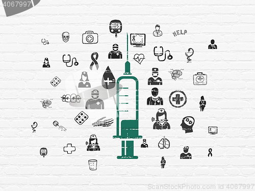 Image of Healthcare concept: Syringe on wall background