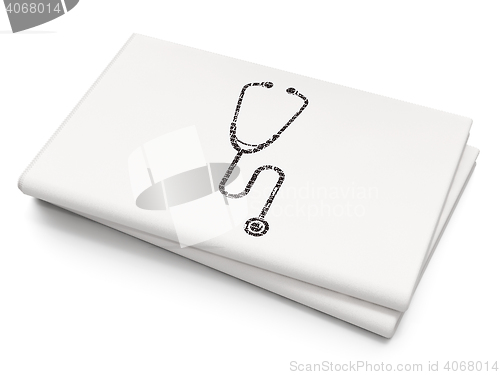 Image of Healthcare concept: Stethoscope on Blank Newspaper background