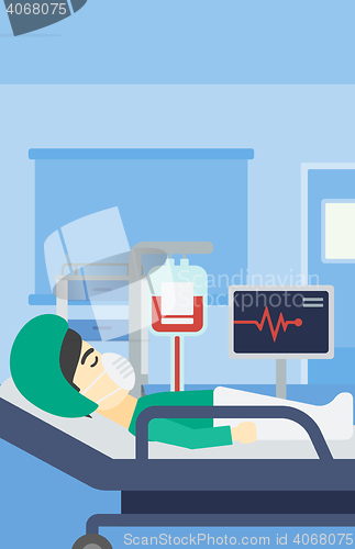 Image of Patient lying in hospital bed with heart monitor.