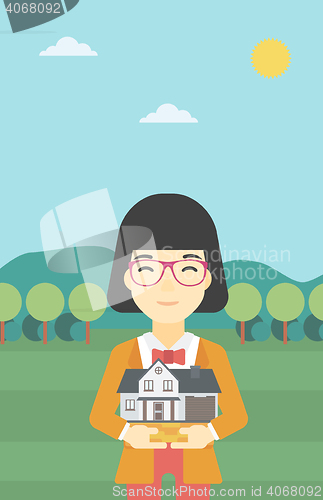 Image of Woman holding house model vector illustration.