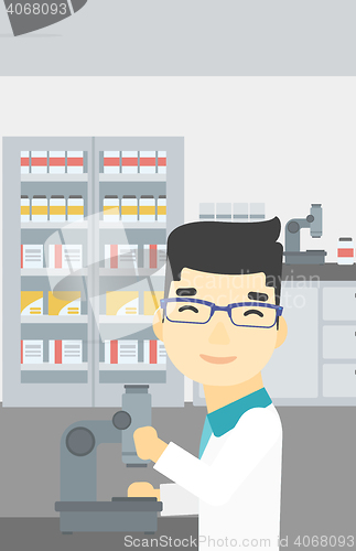 Image of Laboratory assistant with microscope.