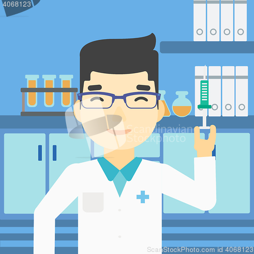 Image of Laboratory assistant with syringe in lab.