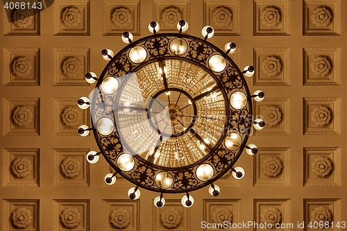 Image of Chandelier on decoarted ceiling