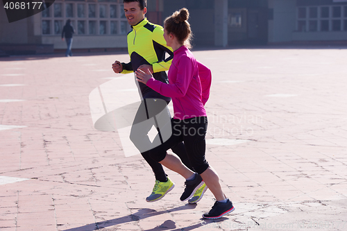 Image of young  couple jogging