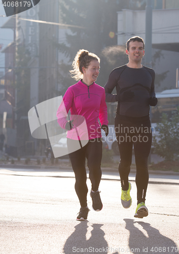 Image of young  couple jogging