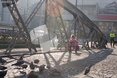 Image of sporty woman jogging on morning