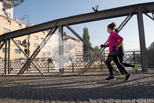 Image of young  couple jogging