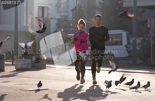 Image of young  couple jogging