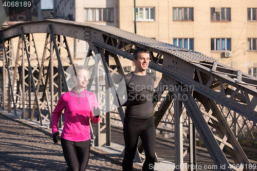 Image of young  couple jogging