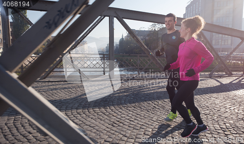 Image of young  couple jogging