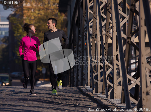 Image of young  couple jogging