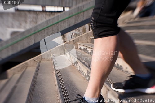 Image of woman jogging on  steps