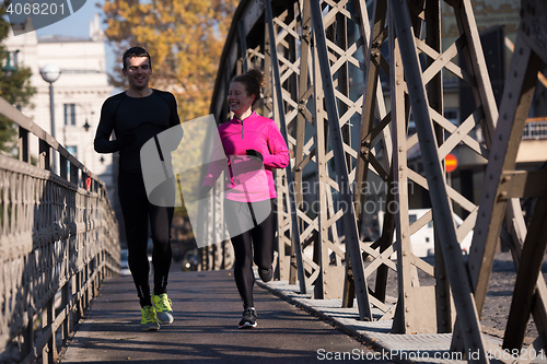 Image of young  couple jogging