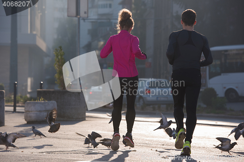 Image of young  couple jogging