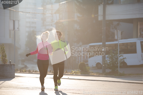 Image of young  couple jogging