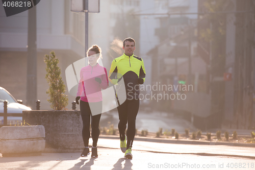 Image of young  couple jogging