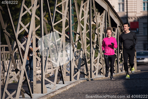 Image of young  couple jogging
