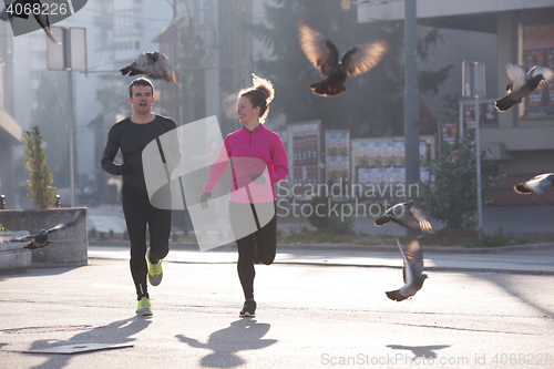 Image of young  couple jogging