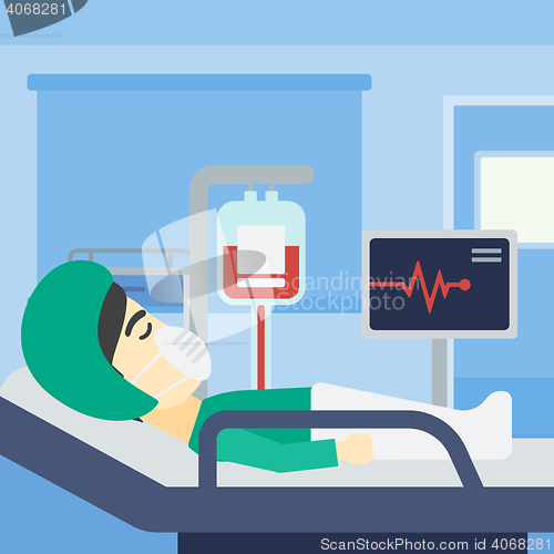 Image of Patient lying in hospital bed with heart monitor.