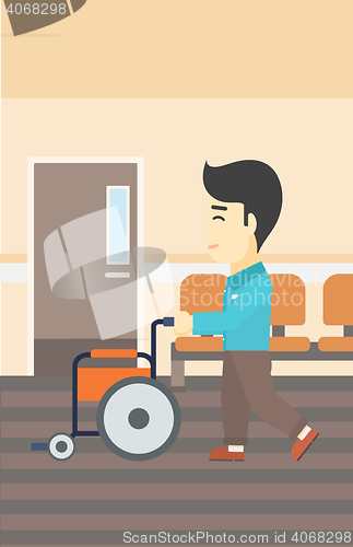 Image of Man pushing wheelchair vector illustration.