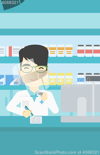 Image of Pharmacist writing prescription.