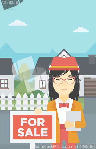 Image of Real estate agent offering house.