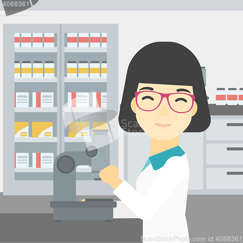 Image of Laboratory assistant with microscope.