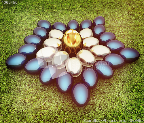 Image of Blue metallic, metall and Gold Easter eggs as a flower on a gree