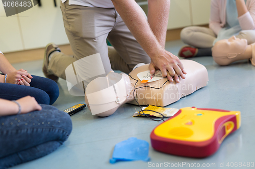 Image of First aid resuscitation course using AED.