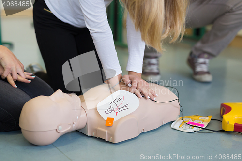 Image of First aid resuscitation course using AED.