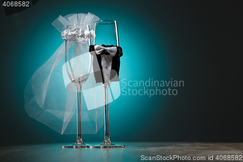 Image of Stylized champagne glasses in wedding theme