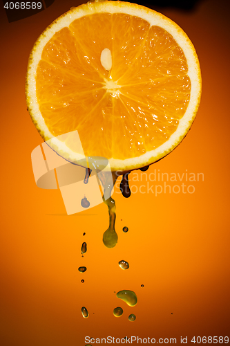 Image of One half of orange isolated on colorful background