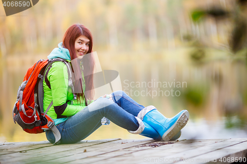 Image of Long-haired brunette with backpack