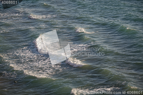 Image of Light frothy waves of the black sea near shore