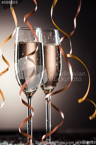 Image of Stylish image of two champagne glasses and ribbons for decoration