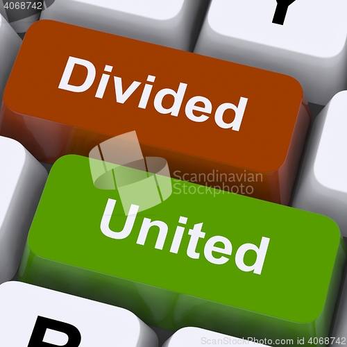 Image of Divided And United Keys Show Partnership Or Teamwork