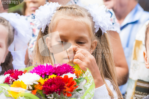 Image of First grader on the first line in September picking his nose