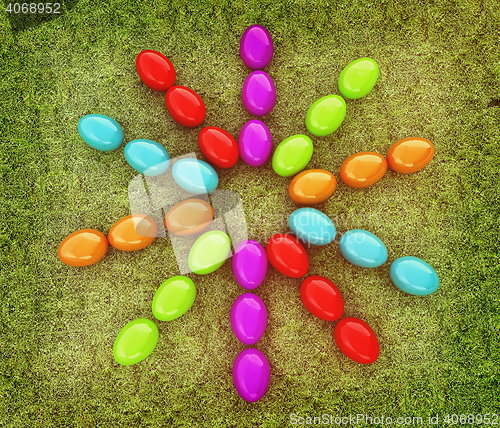 Image of Colored Easter eggs as a flower on a green grass. 3D illustratio