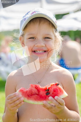 Image of Funny cheerful girl eating watermelon, close-up portrait