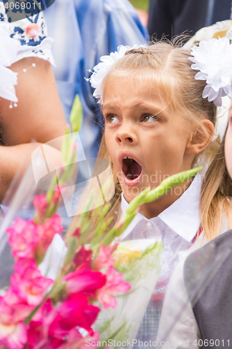 Image of First grader yawning on line the first of September