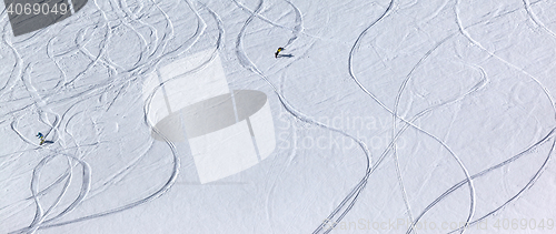 Image of Snowboarders downhill on off piste slope