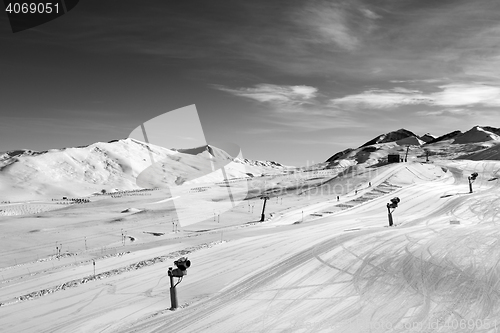 Image of Ski slope with snowmaking at sun day