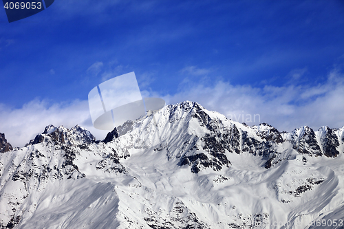 Image of Snow mountains in winter sun day and blue sky with clouds