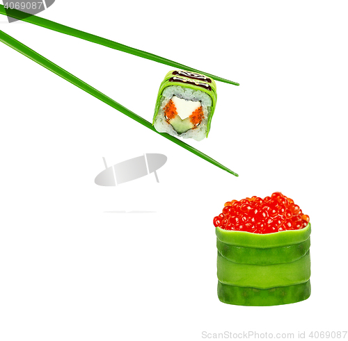 Image of Sushi roll with chopsticks