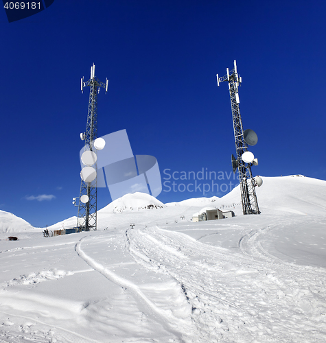 Image of Ratrac ski road and satellite dishes at nice sun day