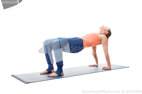 Image of Woman doing Ashtanga Vinyasa Yoga asana Purvottanasana