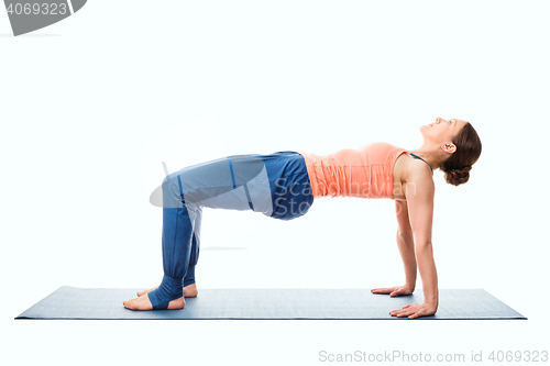 Image of Woman doing Ashtanga Vinyasa Yoga asana Purvottanasana