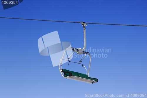 Image of Chair-lift at ski resort and blue clear sky